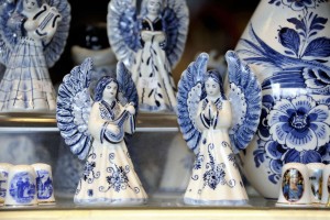 Typical Dutch souvenir of two angels in Delft Blue at a souvenir shop in Delft,Netherlands-1400